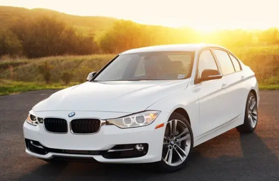 Transfer Learning with ResNet50 on the Stanford Cars Dataset BMW 3 Series white sedan front view in sunset background